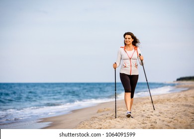 Nordic Walking - Young Woman Working Out On Beach 