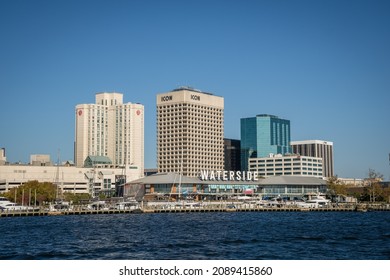 Norfolk, VA, US-November 13, 2021:  View Of The Skyline Of The City On The Waterfront With Iconic Skyscrapers, Restaurants And Naval Ships.