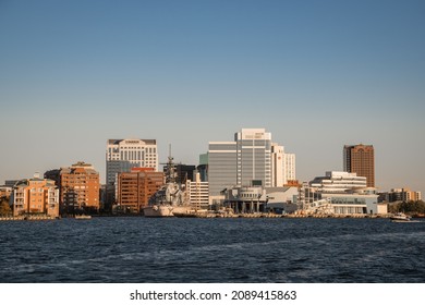 Norfolk, VA, US-November 13, 2021:  View Of The Skyline Of The City On The Waterfront With Iconic Skyscrapers, Restaurants And Naval Ships.