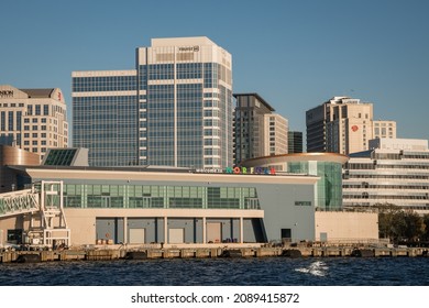 Norfolk, VA, US-November 13, 2021:  View Of The Skyline Of The City On The Waterfront With Iconic Skyscrapers, Restaurants And Naval Ships.