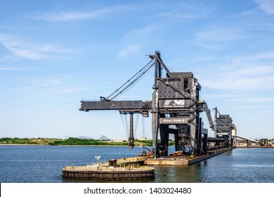 NORFOLK, VA/USA - MAY 15, 2019: Facility at Lamberts Point for loading coal from Virginia, West Virginia, and several other states onto ships for export to China, the Netherlands, and other countries.