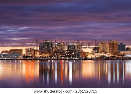 Norfolk, Virginia, USA downtown skyline on the Elizabeth River in the morning.