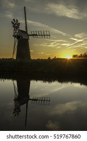 Norfolk Windmill With Reflection At Sunset/sunrise