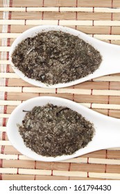 Nori Flakes On White Ceramic Spoon