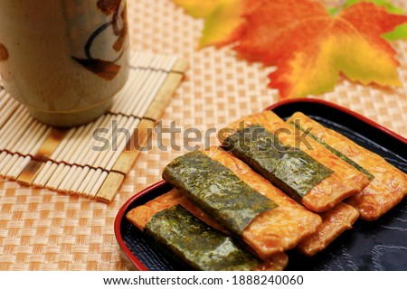 Norimaki rice crackers. Soy sauce flavored rice cracker wrapped with dried laver. A traditional Japanese snack.