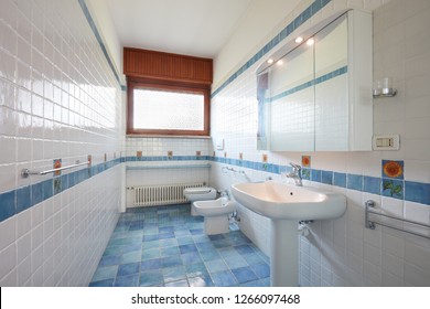 Normal Bathroom With Blue And White Tiles In Apartment Interior