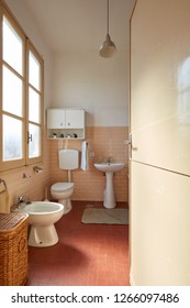 Normal Bathroom With Pink Tiles In Old Apartment Interior