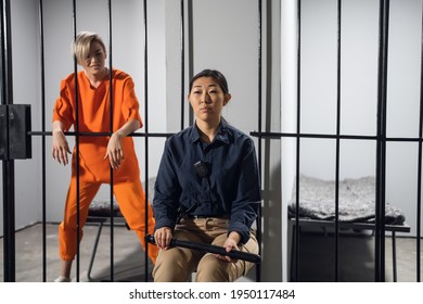 A Normal Day In A Women's Prison, A Female Warden Is On Guard For A Female Criminal