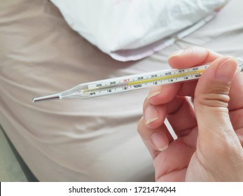 Normal Thermometer With Manually Use Under The Tongue Or Under The Armpits.Showing The Scale Of Temperature Is 37 Celsius Degree, Not Have Fever.Normal Human Temperature.Health Check In The Morning.