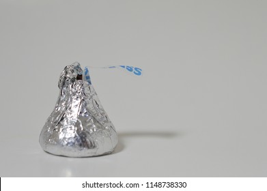 Norman, OK Aug. 8, 2018 A Single Hershey's Chocolate Kiss On A White Studio Background