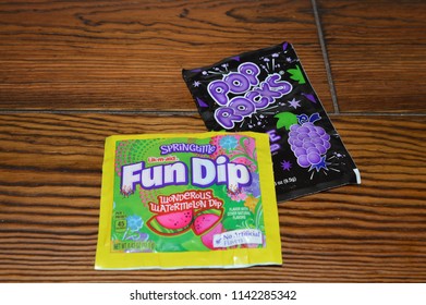 Norman, OK July 21, 2018 A Close Up Photo Of Fun Dip And Pop Rock Candy On A Wooden Table 