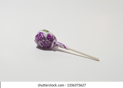 Norman, OK March 9, 2019 Isolated Grape Dum Dum/ Lollipop Sucker On A White Sudio Background