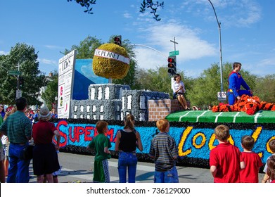 NORMAN, OKLAHOMA - OCTOBER 13 2007: Superman Float Marches On Street In Homecoming Event