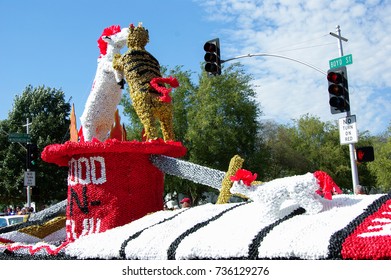 NORMAN, OKLAHOMA - OCTOBER 13 2007: Dynamic Duos Of Good And Evil Float Marches On Streets In Homecoming Event