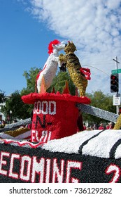 NORMAN, OKLAHOMA - OCTOBER 13 2007: Dynamic Duos Of Good And Evil Float Marches On Streets In Homecoming Event