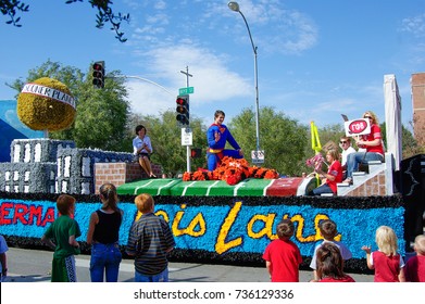 NORMAN, OKLAHOMA - OCTOBER 13 2007: Superman Float Marches On Street In Homecoming Event