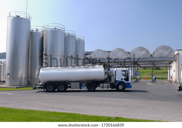 Normandy, France, April 2008.\
\
Dairy\
plant. Milk tanker truck in front of milk storage\
tank