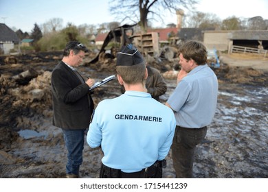 Normandy, France, April 2014.
Arson Attack In A Farm. Farm Building And Farm Equipment Calcined. Rubble. First Observation Of The Police And The Adjuster Investigator With The Farmer