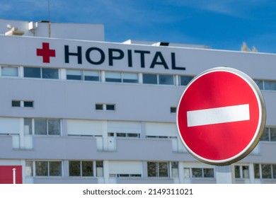 Normandy, France, April 2022. Facade Of A Red Cross Hospital With No Entry Sign. Blursharp Effect