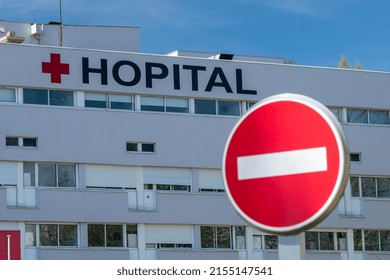 Normandy, France, April 2022. Facade Of A Red Cross Hospital With No Entry Sign. BlurSharp Effect