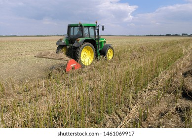 Normandy, France, July 2007.
Crushing Rapeseed Stem After Harvest With A Straw  Chopper