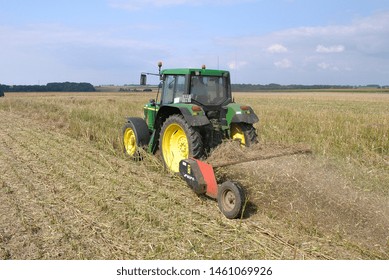 Normandy, France, July 2007.
Crushing Rapeseed Stem After Harvest With A Straw  Chopper