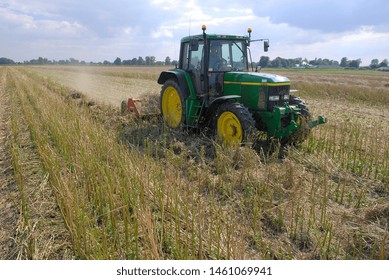 Normandy, France, July 2007.
Crushing Rapeseed Stem After Harvest With A Straw  Chopper