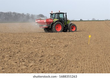 Normandy, France, March 2007.
Spring fertiliser application on a  field before beet sowings. Tractor with spreader