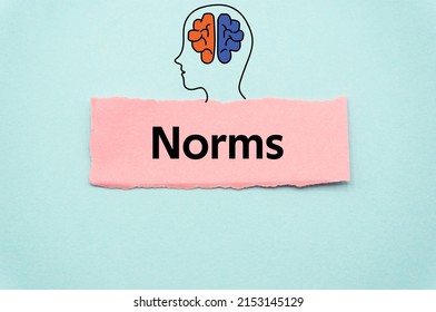 Norms.The word is written on a slip of colored paper. Psychological terms, psychologic words, Spiritual terminology. psychiatric research. Mental Health Buzzwords.