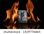 Norse rune Fehu. Wealth, creativity, passion, fire. Rune Fehu is associated with the Scandinavian goddess Freya. The rune is isolated in the background of the flames.