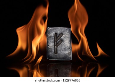 Norse rune Fehu. Wealth, creativity, passion, fire. Rune Fehu is associated with the Scandinavian goddess Freya. The rune is isolated in the background of the flames.