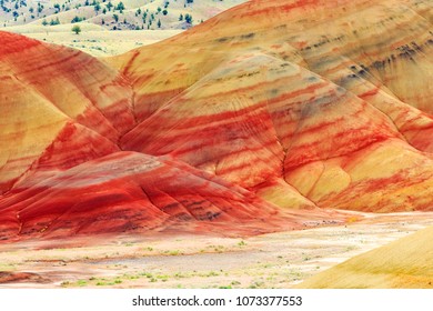 North America, United States, Oregon, Central Oregon, Redmond, Bend, Mitchell. Series of low clay hills striped in colorful bands of minerals, ash and clay deposits.