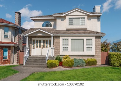 North American Family House On Blue Sky Background