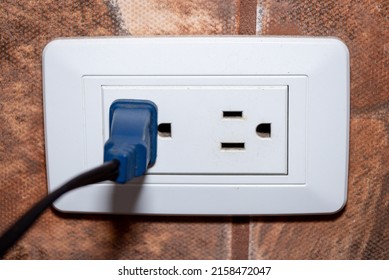 North American U S  electrical socket outlet plug isolated in the wall