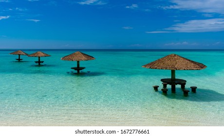 North Malé Atoll, Maldives - December 29 2019 - Umbrellas On The Water In The Maldives