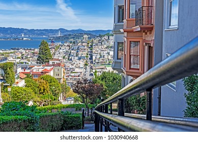 North Beach, Treasure Island, East Bay, Oakland, and Coit Tower photographed from the top of famous Lombard street in the Russian Hill and Nob Hill area of San Francisco, California, USA.
