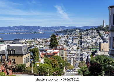 North Beach, Treasure Island, East Bay, Oakland, and Coit Tower photographed from the top of famous Lombard street in the Russian Hill and Nob Hill area of San Francisco, California, USA.