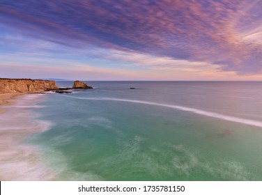 North California Coast Line During Sunset, Norcal, With Cloud Purple Coverage And Smoothed Waves