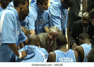 North Carolina Men's Basketball Coach Roy Williams Fires Up His Team In A Huddle