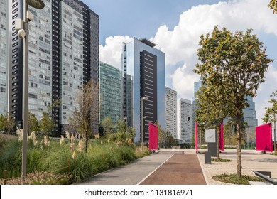 North Entrance To La Mexicana City Park In Santa Fe, Mexico City With Modern Buildings Beside