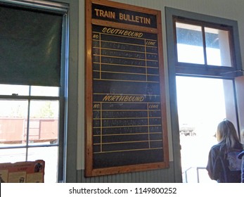 NORTH FREEDOM, WISCONSIN / USA - October 11, 2014: Ticket Office And  Vintage Train Schedule Board In The Depot At The Mid-Continent Railway Museum