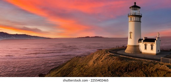 North head lighthouse at the mouth of the Columbia River at a headland at sunset on the south Washington state coast - Powered by Shutterstock