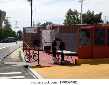 North Hollywood, CA USA - May 28, 2021:  Security Guard Checking In A Resident At The Chandler Tiny Home Village For Homeless People