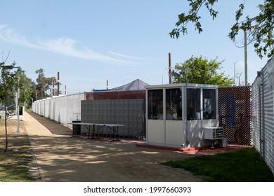 North Hollywood, CA USA - May 28, 2021:  Security Guard And Lockers At Alexandria Park Tiny Home Village For Homeless People On Laurel Canyon Blvd