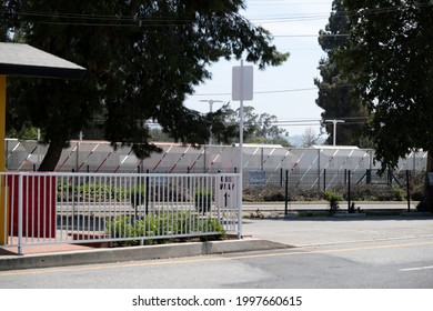 North Hollywood, CA USA - May 28, 2021:  The Tiny Homes For Homeless At The Chandler Boulevard Bridge Home Village For Homeless People Seen Through The Perimeter Fence