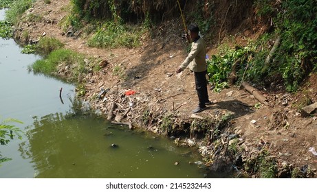 North Jakarta, Indonesia - April, 12, 2022: Fishing In Pluit Reservoir Park.