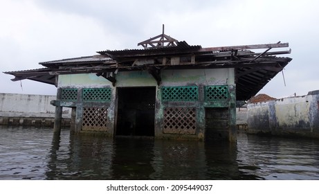 North Jakarta, Indonesia - Dec, 23, 2021: Wal Adhuna Mosque In North Jakarta Due To Global Warming Experienced A Decrease In Land And Sea Level Rise.