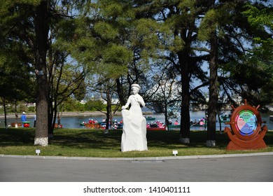 North Korea - May 3, 2019: Inside The Songdowon International Children’s Camp. Statue Of A Pioneer Girl Symbolizing A Young Geologist