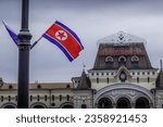 The North Korean flag and the building of Vladivostok railway station with the word "Vladivostok" (in Russian), before North Korea leader Kim Jong Un
