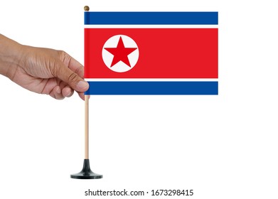 North Korean Flag On Wood Pole White Background